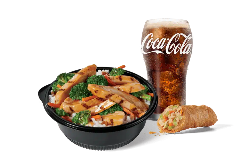 A hearty chicken teriyaki bowl filled with savory grilled chicken, vibrant broccoli, carrots over fried rice, accompanied by a crispy spring roll, and a glass of Coca-Cola with foam on top, set against a clear backdrop for a fulfilling meal.