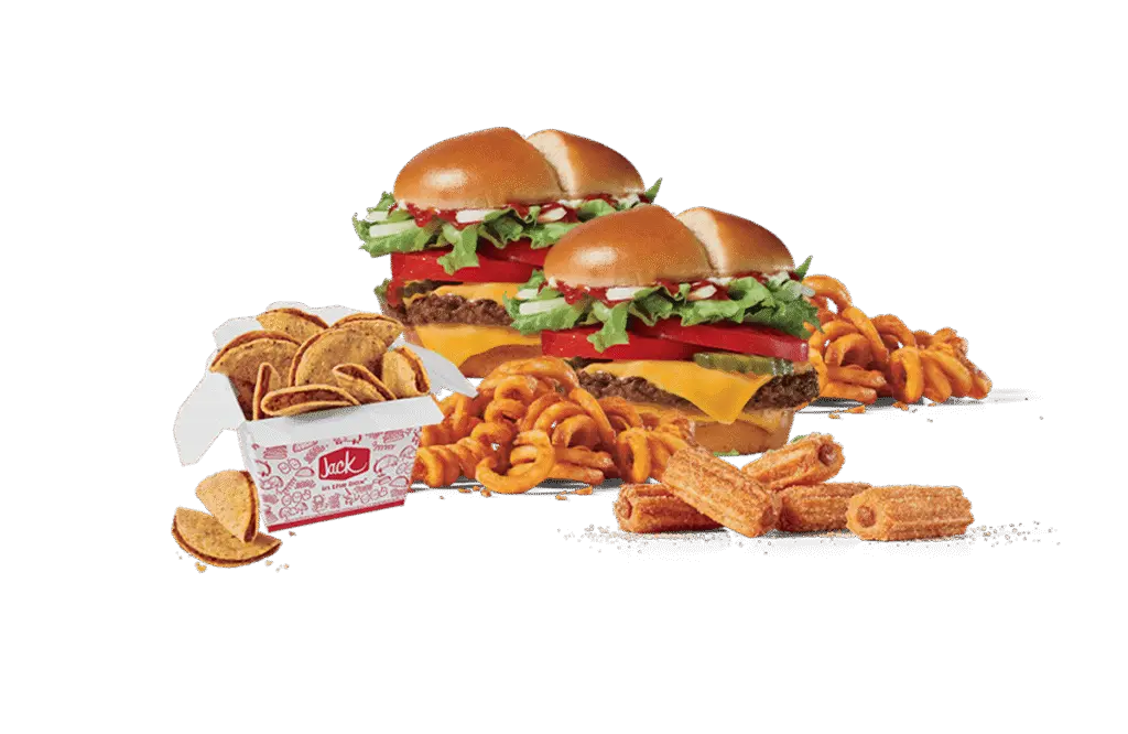 An assortment of fast food items including two cheeseburgers with fresh toppings, a box of crunchy taco chips, curly fries, and crispy churros, all set against a dark background.