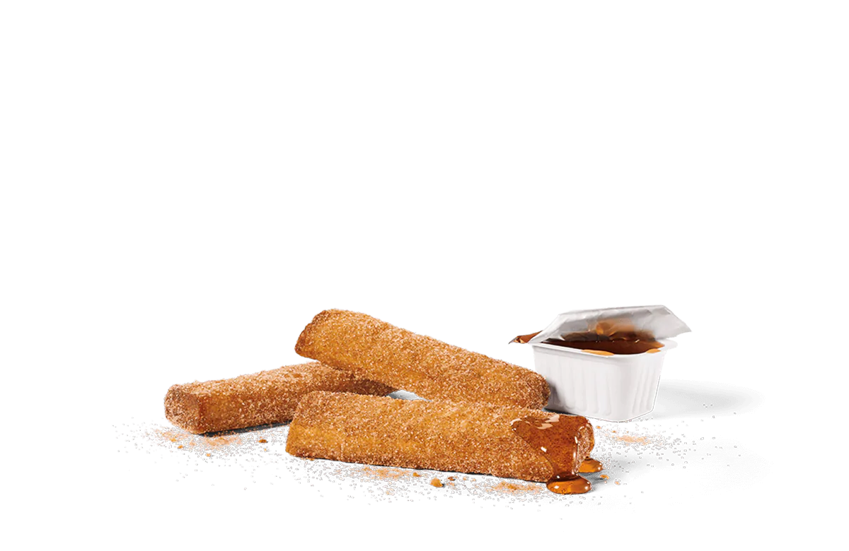 Three cinnamon sugar-coated churro-style French toast sticks served with a container of syrup, with sugar sprinkles and syrup dripping for a delicious presentation on a transparent background.