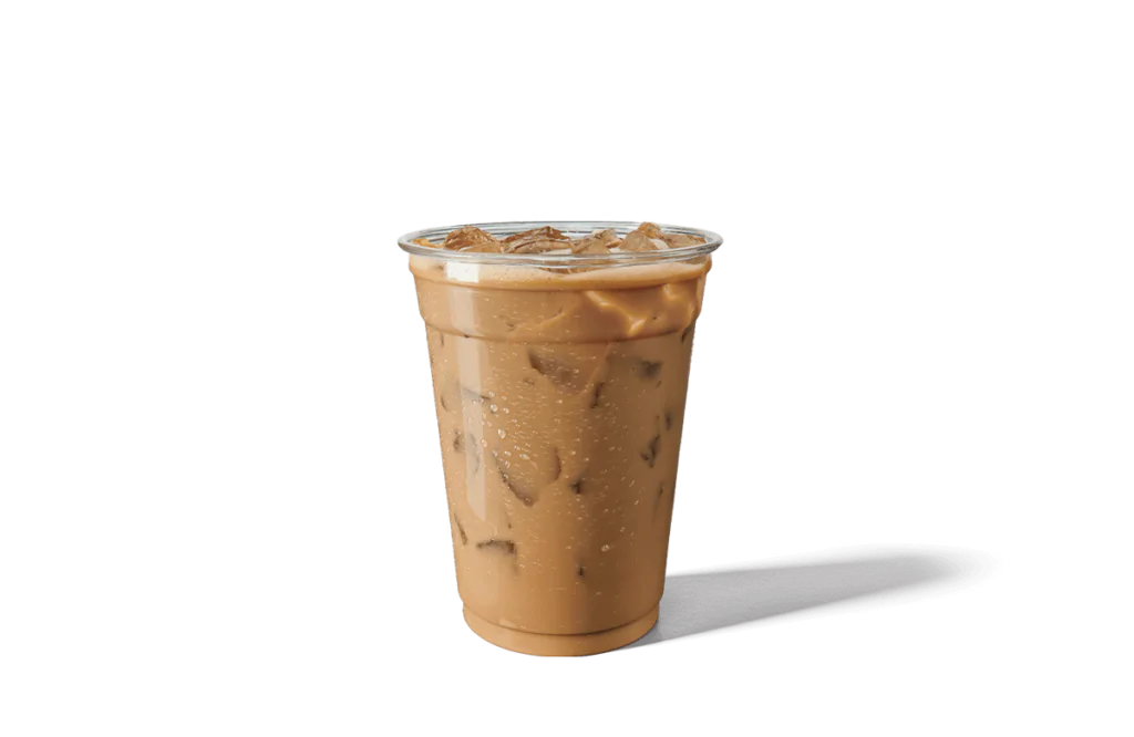 A tall clear plastic cup filled with Caramel Sweet Cream Iced Coffee, showcasing a rich caramel-colored coffee blend mixed with sweet cream and topped with ice cubes. The cup has a transparent lid and is adorned with condensation, giving it a refreshing and appetizing appearance.