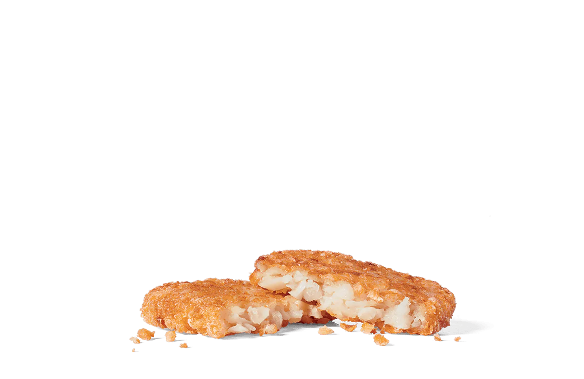 Image of crispy hash browns with a golden-brown exterior, showcasing the textured, crunchy surface and visible tender, shredded potato inside.