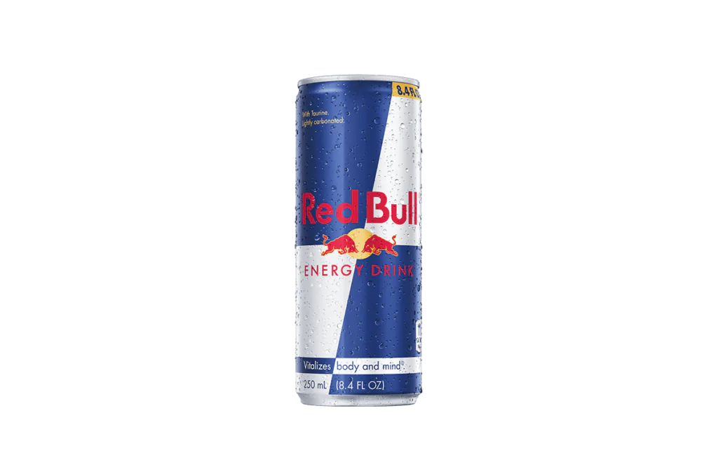 A single 8.4 fl oz (250 mL) can of Red Bull® Energy Drink, featuring its iconic blue and silver design with the Red Bull logo, lightly covered in condensation for a refreshing appearance.