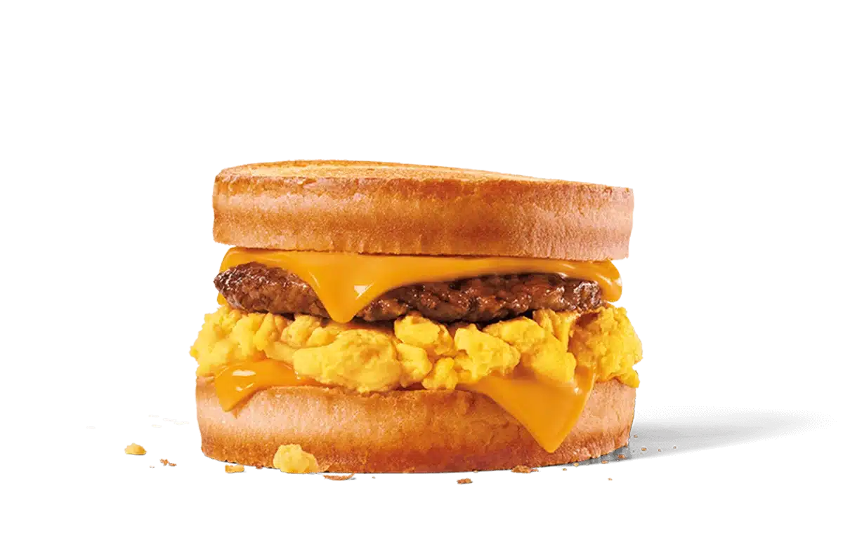 Image of a Sausage, Egg & Cheese Scrambler sandwich featuring fluffy scrambled eggs, a juicy sausage patty, and melted American cheese sandwiched between two lightly toasted English muffins, showcasing a hearty and savory breakfast option.