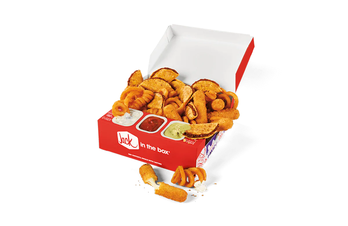 A box filled with a variety of Jack in the Box's fan-favorite side items, including curly fries, potato wedges, and mozzarella sticks, served with dipping sauces of ranch, ketchup, and avocado.