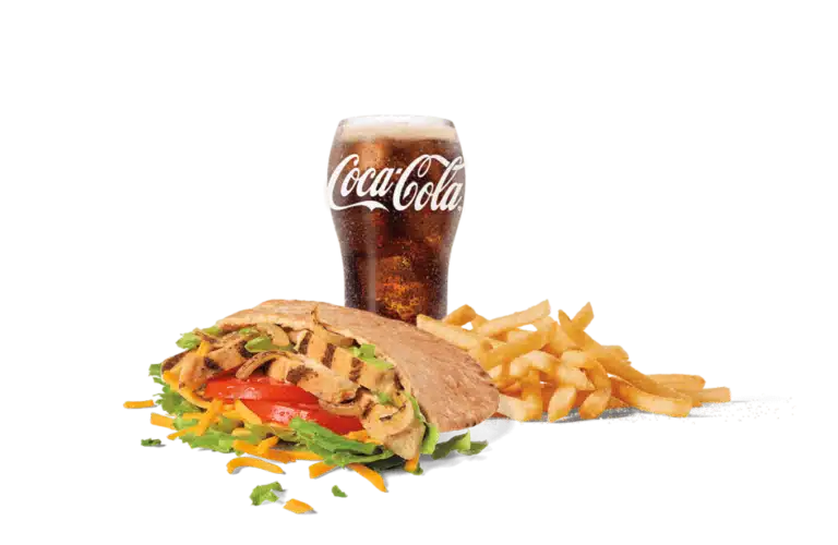 A delicious chicken fajita pita filled with grilled chicken strips, fresh lettuce, tomato, and shredded cheese, served with a side of golden fries and a glass of Coca-Cola, set against a clear background.