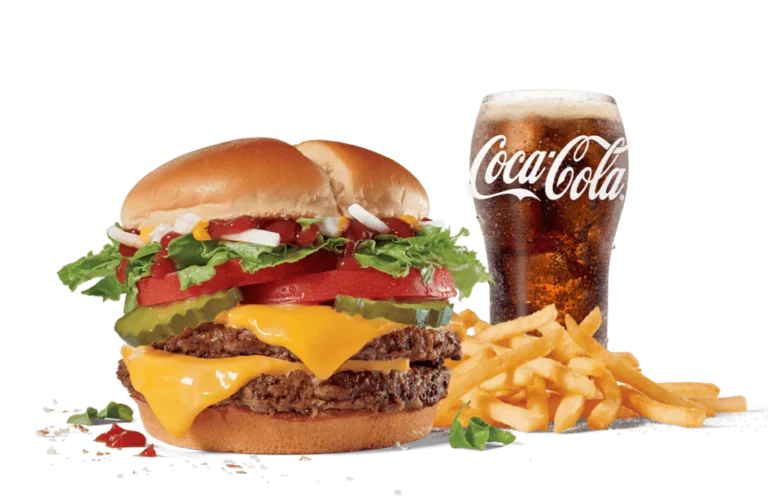 A Double Jack® burger loaded with two beef patties, cheese, lettuce, tomato, and onions, served with a side of fries and a cold Coca-Cola, against transparent backdrop.