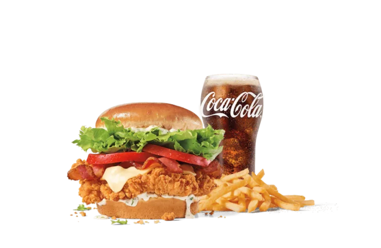 The Homestyle Ranch Chicken Club Combo includes a crispy chicken sandwich dressed with ranch sauce, bacon, fresh lettuce, and tomato on a toasted bun, served with fries and a glass of Coca-Cola on transparent background.