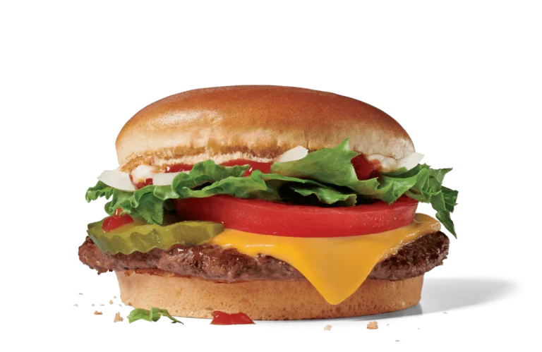 Image of a Jr. Jumbo Jack Cheeseburger featuring a smaller beef patty topped with a slice of melted cheese, fresh tomato, lettuce, pickles, and onions, drizzled with ketchup and mustard, served on a soft round bun.