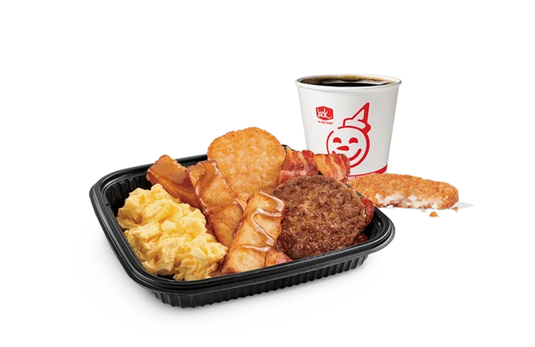 Image of a 3-piece Classic French Toast Sticks platter from Jack in the Box, featuring both crispy bacon and a savory sausage patty alongside scrambled eggs and a cup of hot coffee. This satisfying breakfast combo is served in a black tray against a transparent background, embellished with the cheerful Jack in the Box logo.