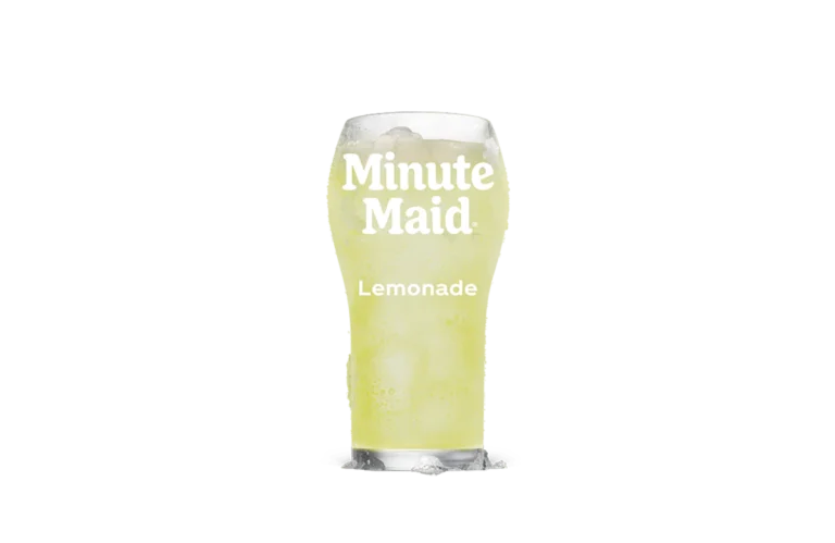 A refreshing glass of Minute Maid® Lemonade, filled with ice cubes and showcasing a pale yellow hue, highlighting the classic citrus beverage's chilled and thirst-quenching appeal.