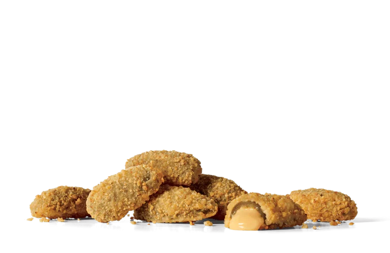 A pile of crispy breaded stuffed jalapeños on transparent background. One of the jalapeños is cut open, revealing a creamy cheese filling oozing out. The jalapeños are golden brown and coated with a crunchy breadcrumb mixture.